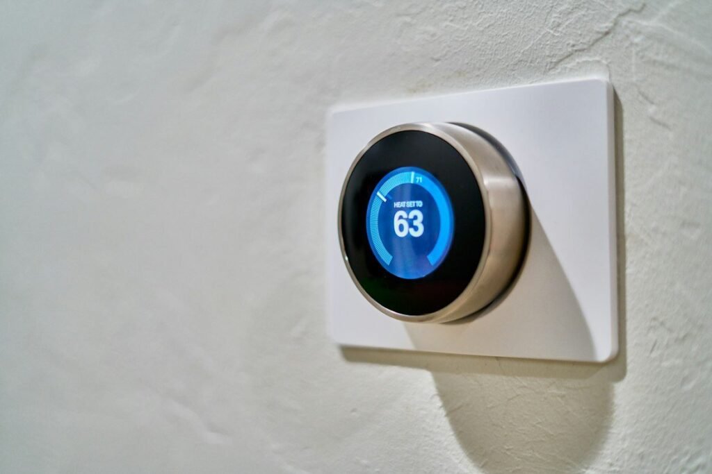 Wall thermostat reading 63°F with the heat set to 71°F.
