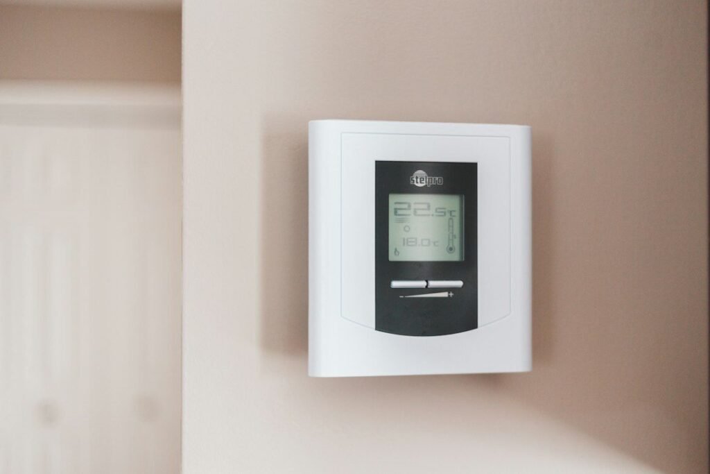 Wall thermostat displaying the indoor temperature.