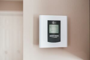 Wall thermostat displaying the indoor temperature.